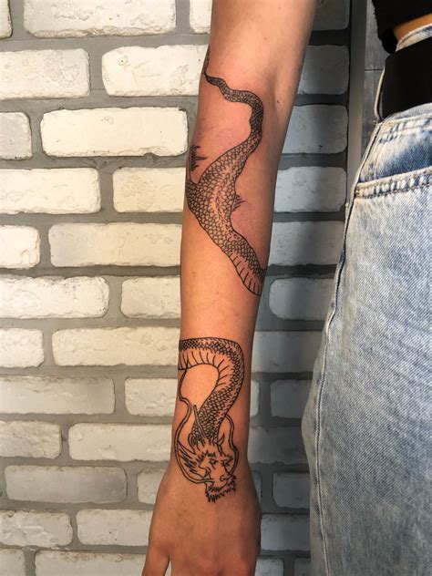 dragon wrapped around arm tattoo|dragon arm full body tattoo.